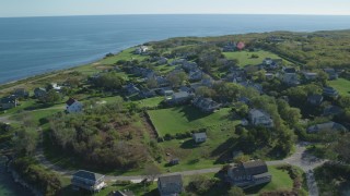 AX144_174 - 5.5K aerial stock footage orbiting coastal community, Cuttyhunk Island, Elisabeth Islands, Massachusetts