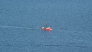 AX144_181 - 6k aerial stock footage tracking a fishing boat on the Atlantic Ocean