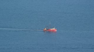 AX144_182 - 6k aerial stock footage tracking a fishing boat on the Atlantic Ocean