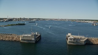 AX144_190E - 6k aerial stock footage approaching harbor, Palmer Island Light and New Bedford, Massachusetts