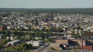 AX144_198 - 6k aerial stock footage of a residential neighborhood, St Anthony of Padua Parish, New Bedford, Massachusetts