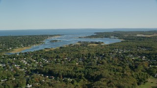 AX144_209E - 6k aerial stock footage flying by Apponagansett Bay, Dartmouth, Massachusetts