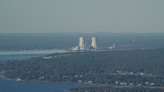 AX144_222E - 6k aerial stock footage flying by Dynegy Brayton Point coal-fired power plant, Somerset, Massachusetts