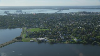 AX144_226 - 6k aerial stock footage approaching, fly over coastal community, Newport, Rhode Island