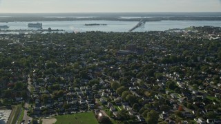 AX144_226E - 6k aerial stock footage approaching, fly over coastal community, Newport, Rhode Island