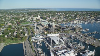 AX144_231 - 6k stock footage aerial video flying by coastal community, revealing piers, Newport, Rhode Island