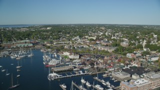 AX144_234 - 6k stock footage aerial video orbiting coastal community, piers, Newport, Rhode Island