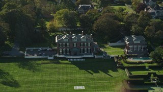 AX144_259 - 6k stock footage aerial video flying by an estate, green lawns, Newport, Rhode Island