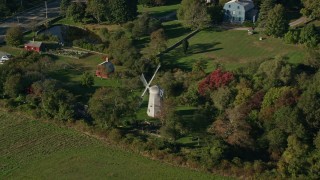 AX145_003 - 6k aerial stock footage approaching a windmill, tilt down, Portsmouth, Rhode Island