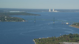 AX145_009 - 6k aerial stock footage flying by Mount Hope Bridge, Dynegy Brayton Point, Portsmouth, Rhode Island