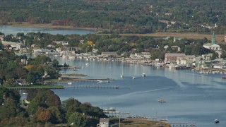 AX145_016 - 6k aerial stock footage flying by small coastal town, waterfront properties, sailboats, Warren, Rhode Island