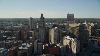 AX145_036E - 6k aerial stock footage flying by the downtown skyline, Downtown Providence, Rhode Island