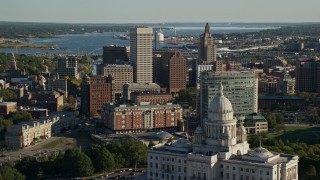 AX145_055E - 6k aerial stock footage flying over the Rhode Island State House toward Downtown Providence, Rhode Island