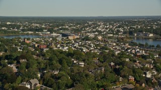 AX145_060 - 6k aerial stock footage flying by a residential neighborhood, pan left, Providence, Rhode Island
