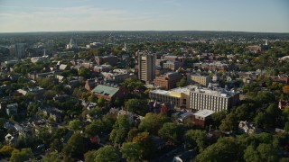 AX145_062E - 6k aerial stock footage flying by Brown University, colorful trees, Providence, Rhode Island