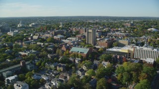 AX145_063 - 6k stock footage aerial video orbiting Brown University, colorful trees, Providence, Rhode Island