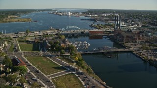 AX145_069 - 6k aerial stock footage approaching Providence River Bridge, factories, Providence, Rhode Island