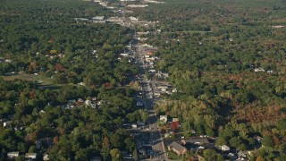 AX145_096 - 6k aerial stock footage flying over small town, Washington Street, autumn, Attleboro, Massachusetts
