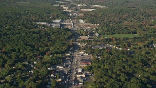AX145_097 - 6k aerial stock footage of a small town, Washington Street, strip malls, autumn, Attleboro, Massachusetts