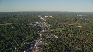 AX145_098 - 6k aerial stock footage flying over Washington Street, strip malls, autumn, Attleboro, Massachusetts