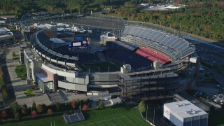 AX145_118 - 6k stock footage aerial video approaching Gillette Stadium, tilt down, autumn, Foxborough, Massachusetts