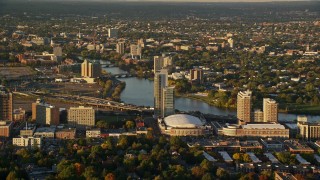 AX146_014E - 6k aerial stock footage approaching Agganis Arena, apartments, Charles River, Boston, Massachusetts, sunset