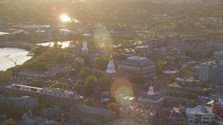 AX146_026 - 6k stock footage aerial video orbiting Harvard University, Cambridge, Massachusetts, sunset