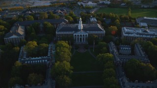 AX146_039 - 6k aerial stock footage of a bird's eye view, Harvard Business School, Harvard University, Massachusetts, sunset
