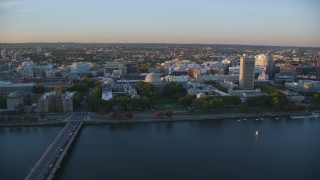AX146_059 - 6k aerial stock footage flying by the Massachusetts Institute of Technology, Massachusetts, sunset