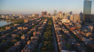 AX146_063 - 6k stock footage aerial video flying over Back Bay, approach Boston Common, Downtown Boston, Massachusetts, sunset