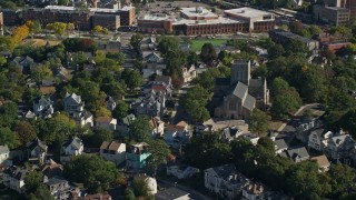 AX147_004 - 6K aerial stock footage flying over suburban homes, church and tree lined streets, Dorchester, Massachusetts