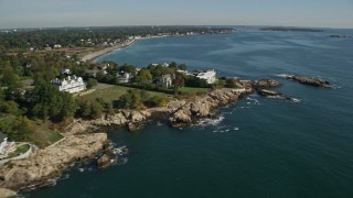 AX147_019E - 6K aerial stock footage approaching coastal mansions among trees, Swampscott, Massachusetts