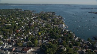 AX147_030E - 6K aerial stock footage orbiting Abbott Hall, coastal community along harbor, Marblehead, Massachusetts