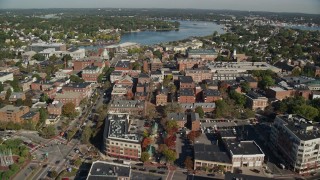 AX147_041 - 6K aerial stock footage flying over brick office and apartment buildings in autumn, Salem, Massachusetts