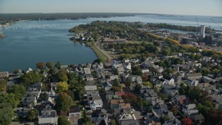AX147_050 - 6K aerial stock footage approaching an elementary school in a coastal town, Salem, Massachusetts