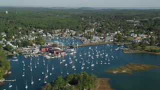 AX147_067 - 6k aerial stock footage flying over harbor with boats in autumn, Manchester-by-the-Sea, Massachusetts
