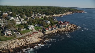 AX147_079E - 6K aerial stock footage flying by oceanfront homes, mansion, Gloucester, Massachusetts