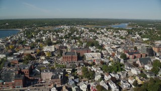 AX147_103E - 6K aerial stock footage of City hall and coastal town, Gloucester, Massachusetts