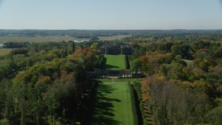 AX147_139 - 6k aerial stock footage revealing The Great House at Crane Estate from water, autumn, Castle Hill, Ipswich, Massachusetts