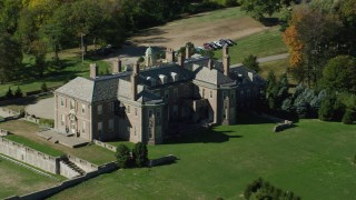 AX147_143 - 6k stock footage aerial video orbiting Castle Hill and The Great House at Crane Estate, autumn, Ipswich, Massachusetts