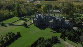 AX147_144 - 6k aerial stock footage orbiting The Great House at Crane Estate on Castle Hill in autumn, Ipswich, Massachusetts