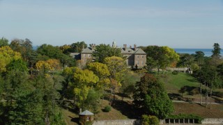 AX147_148 - 6k aerial stock footage approaching The Great House at Crane Estate in autumn, Castle Hill, Ipswich, Massachusetts