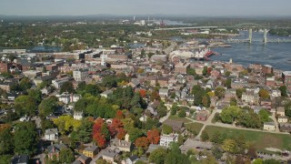 AX147_180 - 6k aerial stock footage of a wide angle of a coastal town in autumn, Portsmouth, New Hampshire