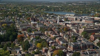 AX147_181E - 6K aerial stock footage of a church steeple among a coastal town in autumn, Portsmouth, New Hampshire