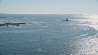 AX147_193 - 6K aerial stock footage approaching a lighthouse in the middle of the water, Kittery, Maine