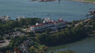 AX147_200 - 6K aerial stock footage orbiting Wentworth by the Sea hotel in autumn, New Castle, New Hampshire