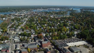 AX147_219 - 6k aerial stock footage flying over coastal town, autumn, Portsmouth, New Hampshire