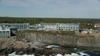 AX147_247 - 6k aerial stock footage flying by Cliff House Maine, colorful autumn trees, York, Maine