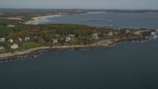 AX147_298E - 6K aerial stock footage approaching a coastal town in autumn, Scarborough, Maine
