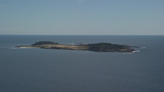 AX147_300 - 6K aerial stock footage flying by Richmond Island, Cape Elizabeth, Maine